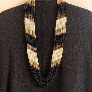 Beaded statement necklace black/gold/white beads/ vintage gold clasp and detail